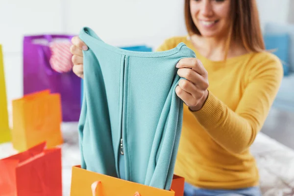 Cheerful Woman Home Looking Her New Purchases Shopping Fashion Concept —  Fotos de Stock