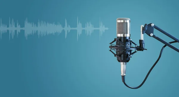 Radio microphone isolated on blue background, concept of podcast, online radio, streaming, entertainment, audio, and communication.