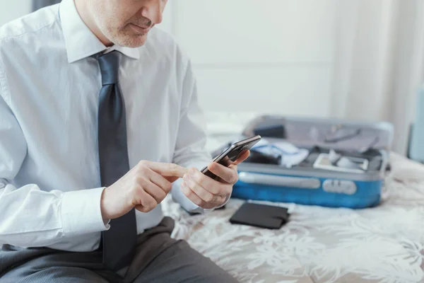 Businessman Traveling Work Using His Smartphone Hotel Room Searching Online — Stok fotoğraf