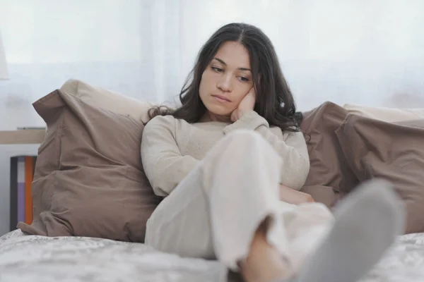 Sad Young Woman Sitting Bed Home She Lonely Depressed — Stockfoto