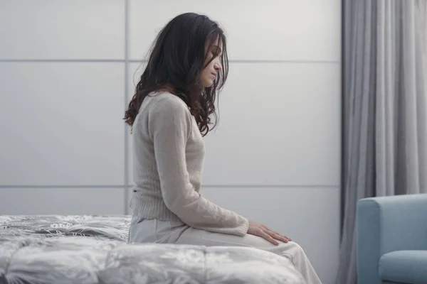 Sad Young Woman Sitting Bed Home She Lonely Depressed — Stok Foto