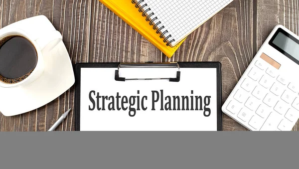 Planowanie Strategiczne Tekst Papierze Kawą Kalkulatorem Notebookiem Biznes — Zdjęcie stockowe