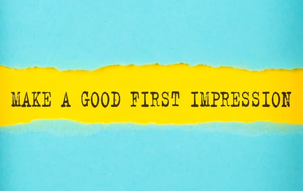 Make a good first impression text on torn paper , yellow background