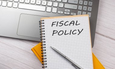 FISCAL POLICY dizüstü bilgisayara yazılmış metin, iş