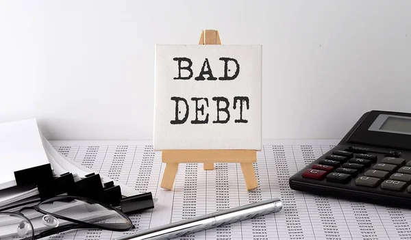Text Bad Debt Stojanu Kancelářskými Nástroji Papírem Pohled Shora Obchodní — Stock fotografie