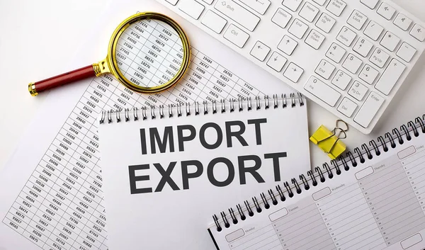 İMPORT EXPORT metni klavye ve planlama ile çizelge üzerine yazılmış