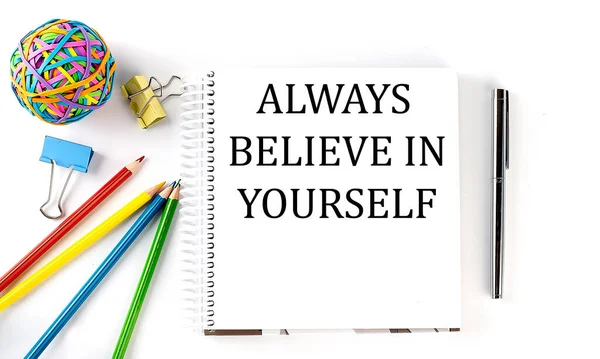 Notebook Pencils Pen Rubber Band Text Always Believe Yourself White — Stock Photo, Image