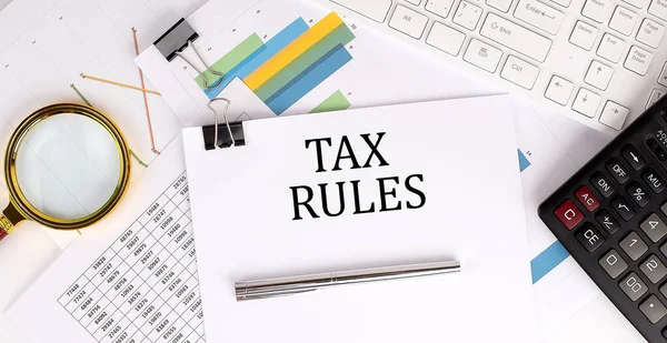 Tax Regras Texto Sobre Papel Branco Sobre Fundo Claro Com — Fotografia de Stock