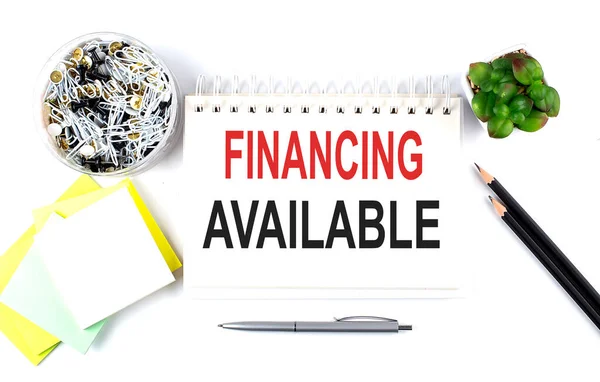 Financing Available Text Notebook Office Supplies White Background — Stock Photo, Image