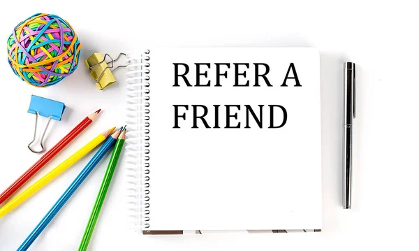 Notebook Pencils Pen Rubber Band Text Refer Friend White Background — Stock Photo, Image