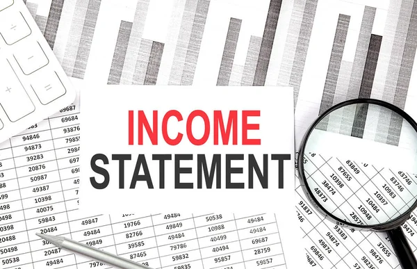 Income Statement Text Paper Calculator Magnifier Pen Graph Background — 图库照片