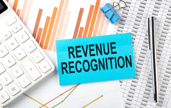 REVENUE RECOGNITION text on sticker on diagram background