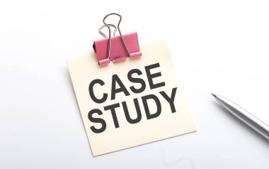 CASE STUDY text on sticker with pen on white background