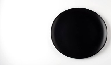 Empty ceramic round plate isolated on the white background, copy space