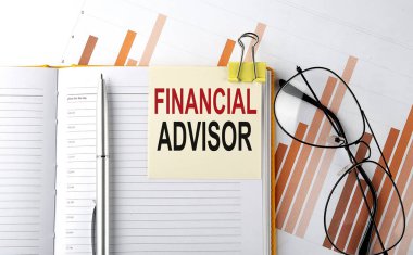 Text FINANCIAL ADVISOR on sticker on notepad on diagram background