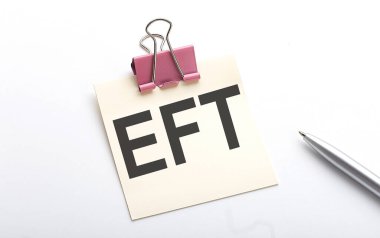 EFT text on the sticker with pen on the white background