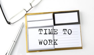 TIME TO WORK text on the sticky notes with glasses and pen, business