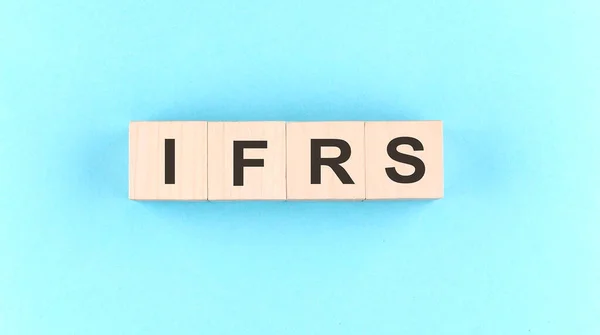 Wooden Cube Block Text Ifrs Blue Background — 图库照片