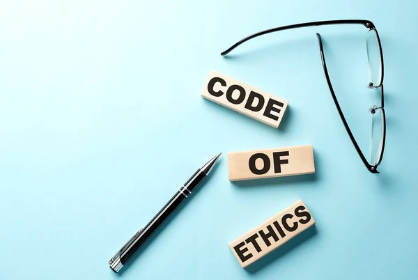 Text Code Ethics Concept Wooden Block Blue Background — Stock Photo, Image