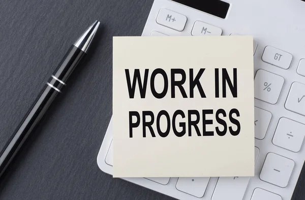 Text Work Progress Sticker Calculator Business Concept — Stock Photo, Image