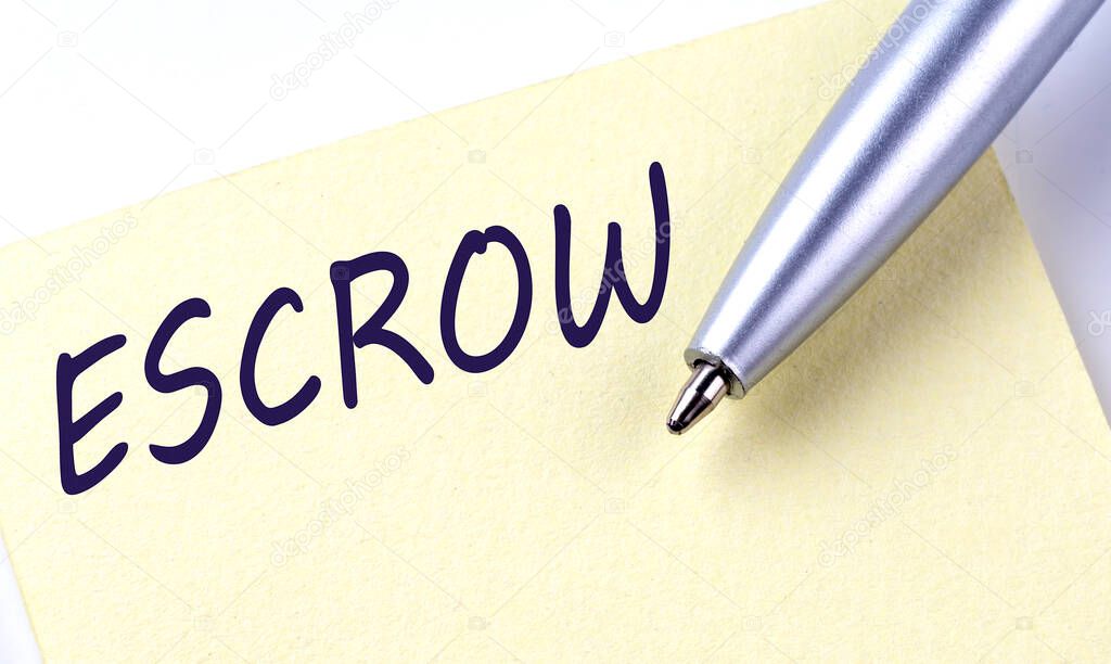 Sticky Note Message ESCROW with pen on a white background