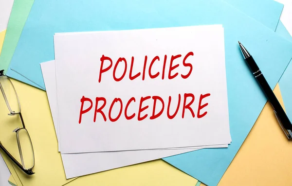 POLICIES PROCEDURE text on a paper on colorful paper background