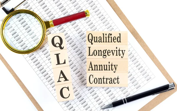 QLAC Qualified Longevity Annuity Contract text on wooden block on a chart background