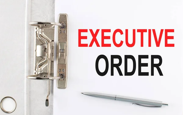 EXECUTIVE ORDER text on paper folder with pen. Business concept