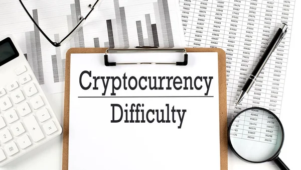 Paper with CRYPTOCURRENCY DIFFICULTY table on a charts, business concept