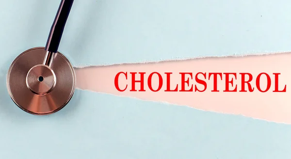 Cholesterol Woord Gemaakt Een Gescheurd Papier Medische Concept Achtergrond — Stockfoto