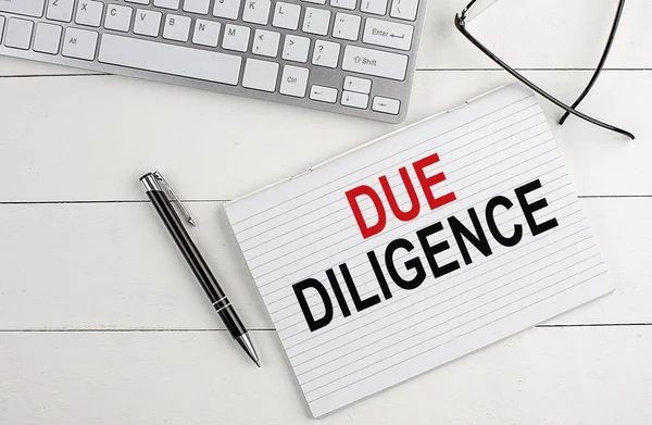 Due Diligence Text Notebook Keyboard Pen Glasses White Wooden Background — Stock Photo, Image