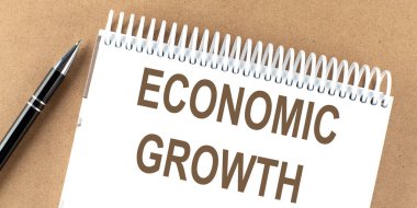 Not defterine kalem ve iş ile ekonom büyütme metni