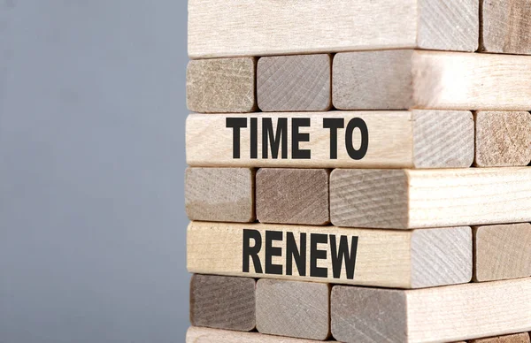 The text on wooden blocks TIME TO RENEW
