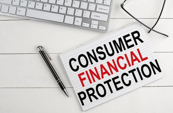 text CONSUMER FINANCIAL PROTECTION on a keyboard on white background