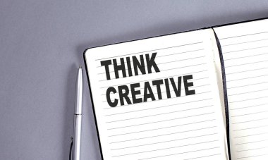 Defterde kalemle yaratıcı bir kelime düşün.