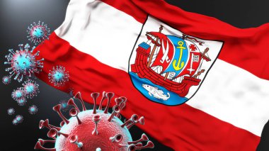 Bremerhaven ve Covid salgını. Virüs Bremerhaven 'ın bayrağına saldırıyor. Virüs salgınıyla mücadele sembolü olarak.