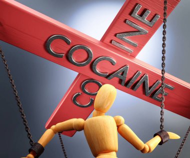 Kokain kontrolü, güç, nüfuz ve manipülasyon kontrol çubuğuyla sembolize edilir. Kokain, tahta bir kuklanın zincirlerini çeker.