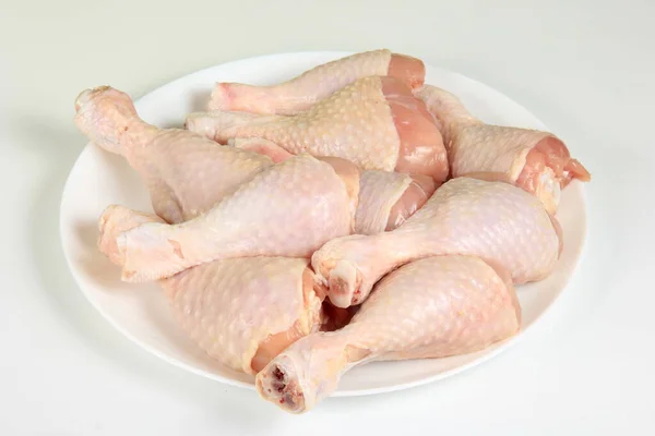 Raw Chicken Legs White Plate White Background Royalty Free Stock Photos