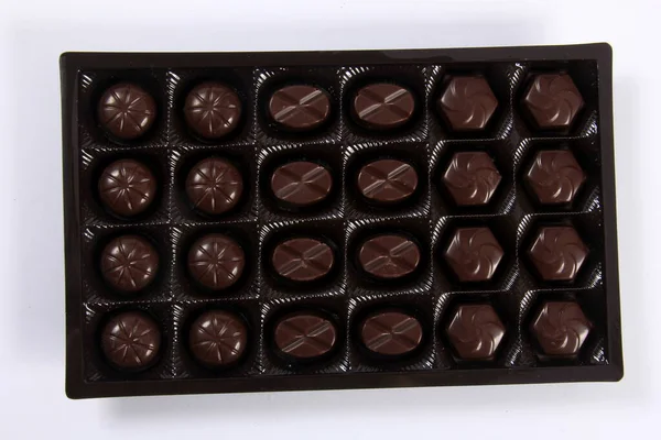 chocolate box. Assorted chocolate pralines in the box. box with chocolate isolated on white