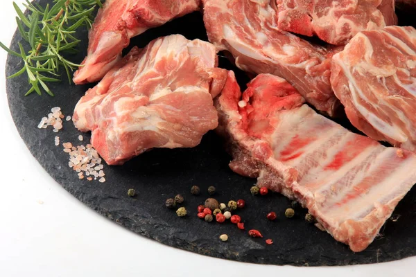 Pieces Raw Meat Black Stone Plate White Background Fresh Meat — Stock Fotó