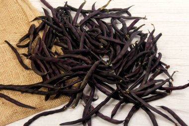 Purple Wax Snap Beans on the white background, Organic fresh beans