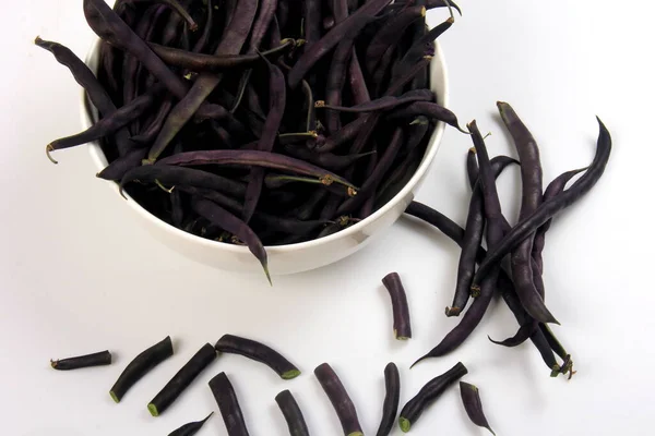 Purple Wax Snap Beans on the white background, Organic fresh beans