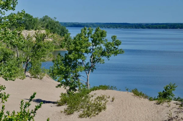 Dunes Beach sand dunes at Sandbanks Provincial Park in Ontario, Canada.   Sandbanks is the largest baymouth barrier dune formation in the world. It is located on Lake Ontario.