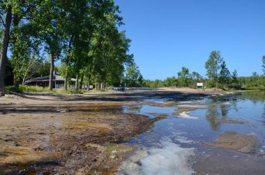 Prince Edward County, Ontario, Canada, July 14, 2022: People enjoy the Dunes Beach at Sandbanks Provincial Park. Sandbanks is located on the north-east side of Lake Ontario.