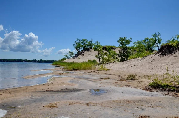 Dunes Beach sand dunes at Sandbanks Provincial Park in Ontario, Canada.   Sandbanks is the largest baymouth barrier dune formation in the world. It is located on Lake Ontario.