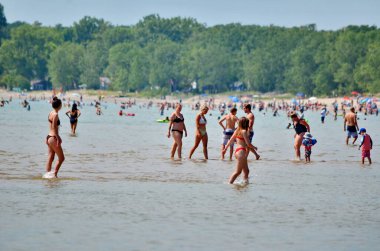 Prince Edward County, Ontario, Canada, July 14, 2022: People enjoy the beach at Sandbanks Provincial Park. Sandbanks is located on the north-east side of Lake Ontario.