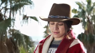 Portrait of Native American Woman with cowboy hat. Young Mixed Race Hispanic Female 