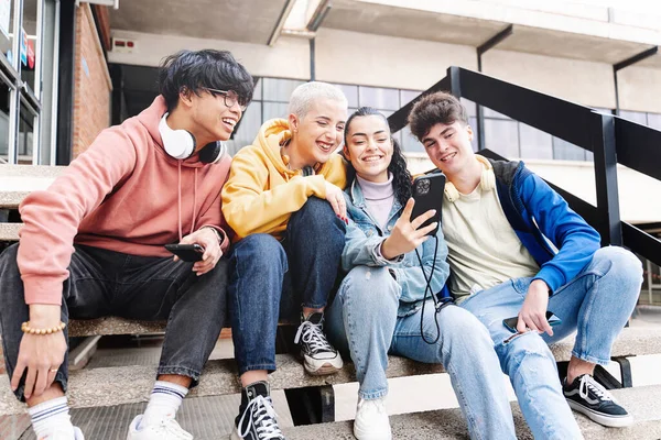 College Student Friends Sitting Campus Staircase Sharing Funny Video Social — kuvapankkivalokuva