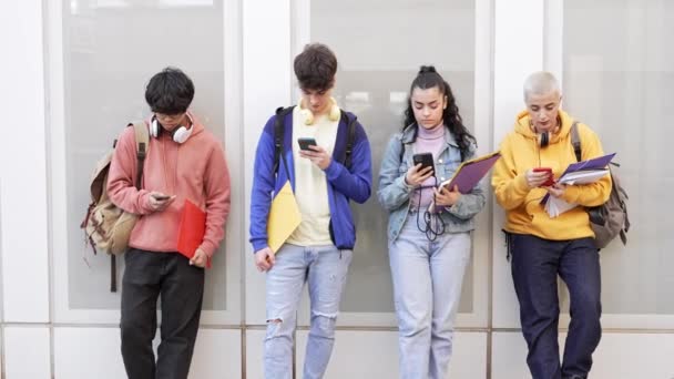 Teenager Students Using Smart Mobile Phones College School Online Internet — Vídeo de stock