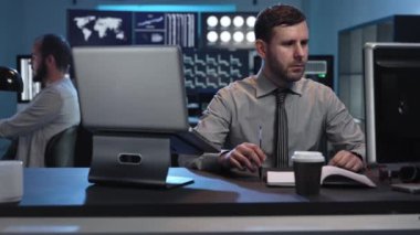 Portrait of business trader professional working in a stock market company office
